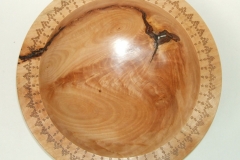 A highly figured Birch bowl with bark inclusions, it measured 250 mm in diameter by 50 mm deep, and a laser design to the top lip.