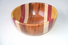 A laminated bowl made from 4 different timbers,( centre out), Goncalo Alves, Sycamore, Purpleheart and Pau Amarillo.